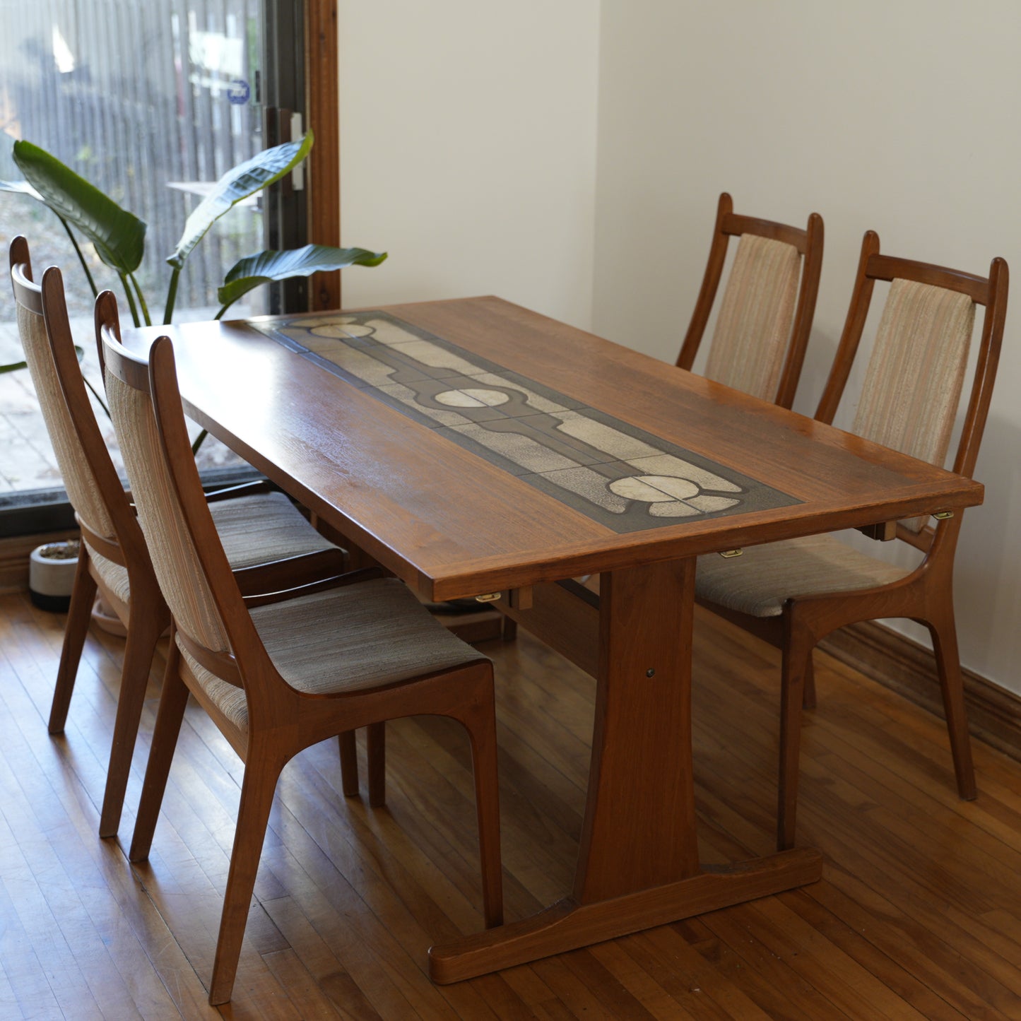 Teak Extendable Dinning Table with Ceramic Tiles, and four chairs.