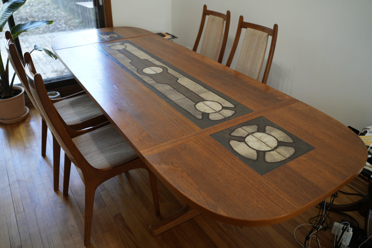 Teak Extendable Dinning Table with Ceramic Tiles, and four chairs.