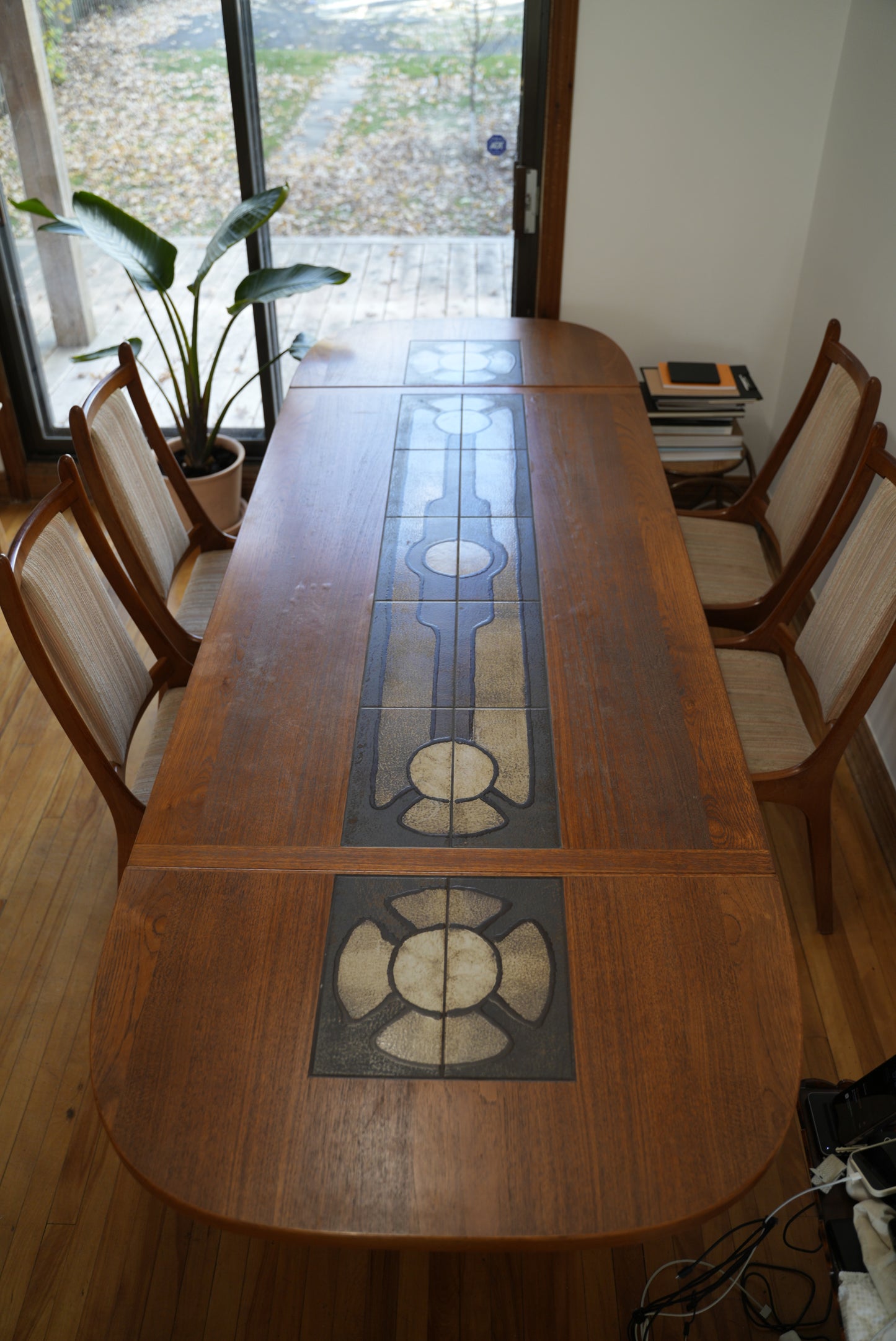 Teak Extendable Dinning Table with Ceramic Tiles, and four chairs.